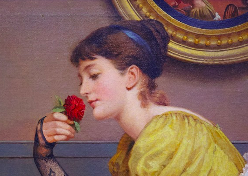 Mulher jovem e bela segurando uma rosa vermelha